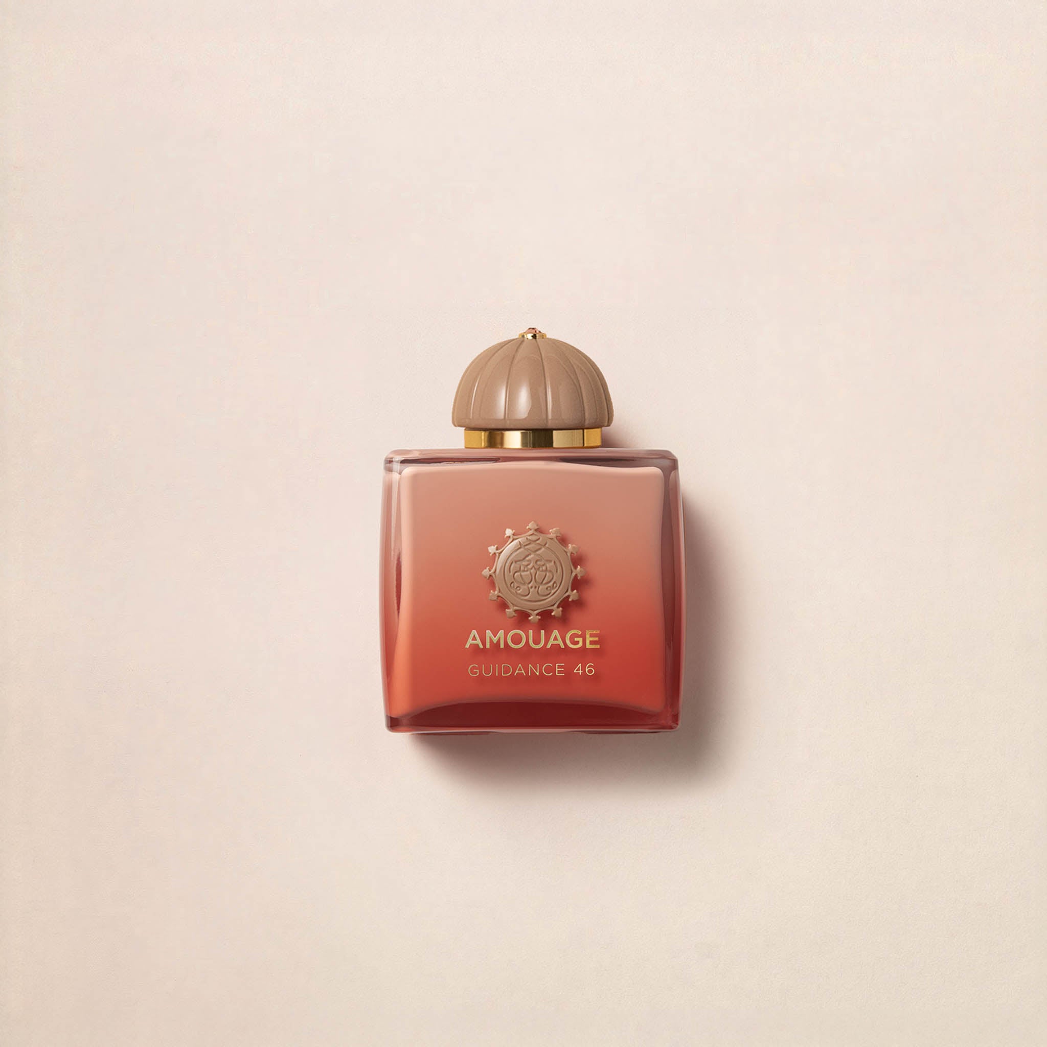 Amouage Guidance 46 Exceptional Extrait bottle with peach-to-terracotta gradient glass